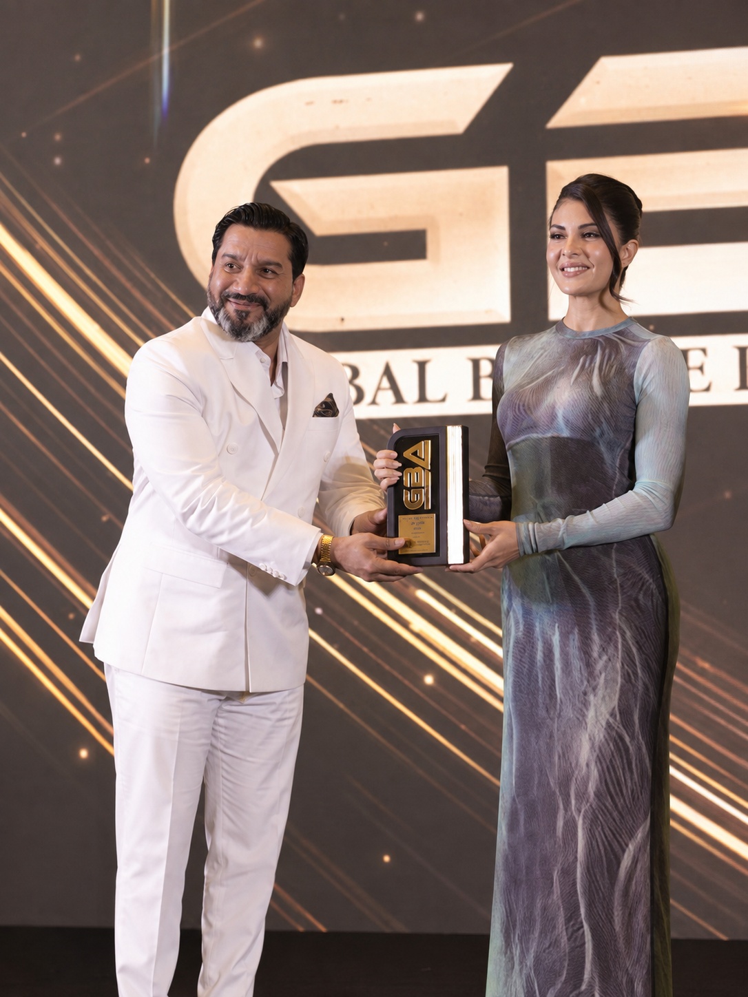 Mr. Pankaj Ashri receiving International Business Award 2025 with Jacqueline Fernandez