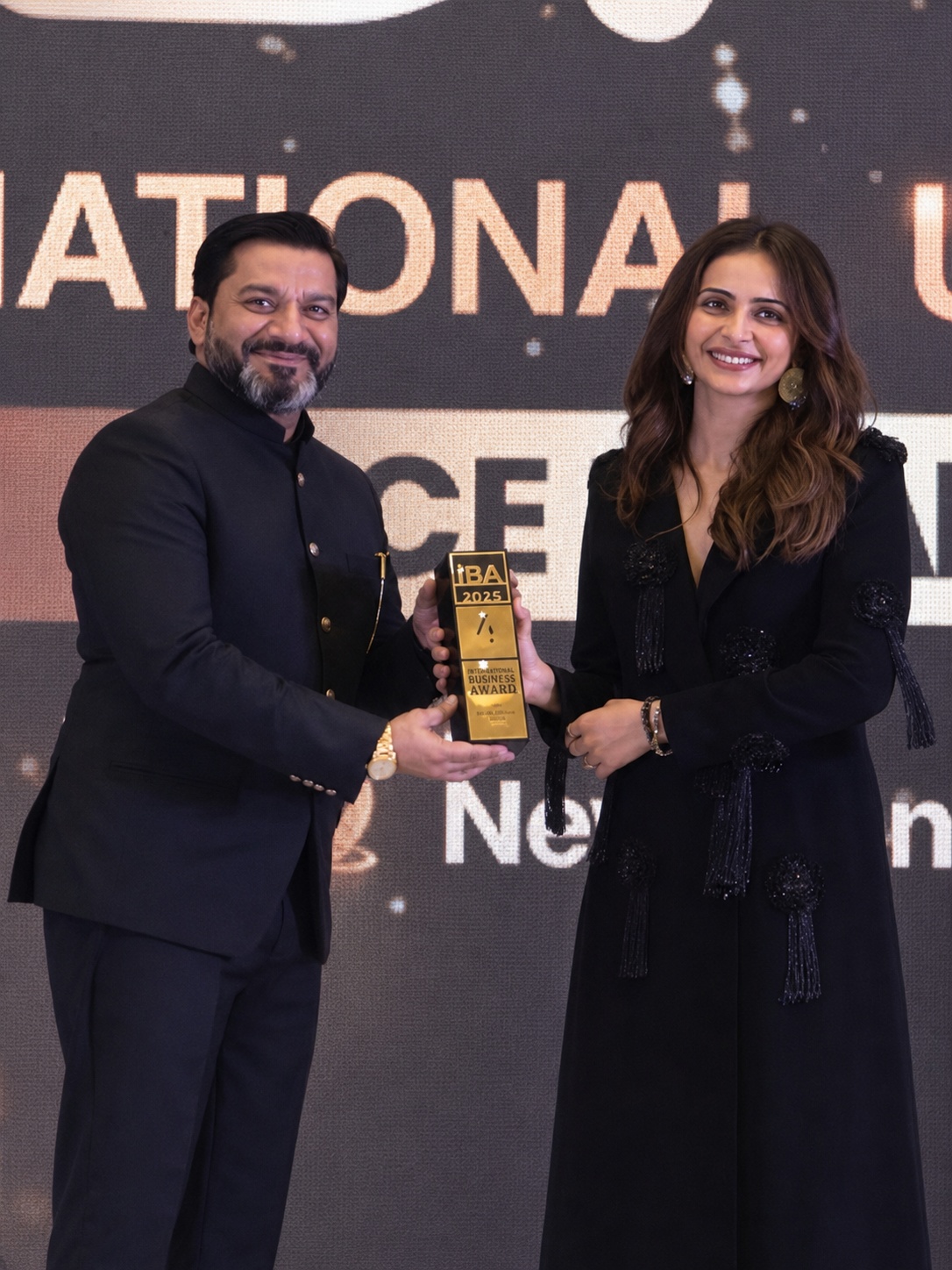 Mr. Pankaj Ashri receiving International Business Award 2025 with Rakul Preet Singh